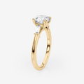 Trilogia Round Straight Baguette Trilogy Moissanite Engagement Ring