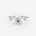 Trilogia Round Straight Baguette Trilogy Moissanite Engagement Ring